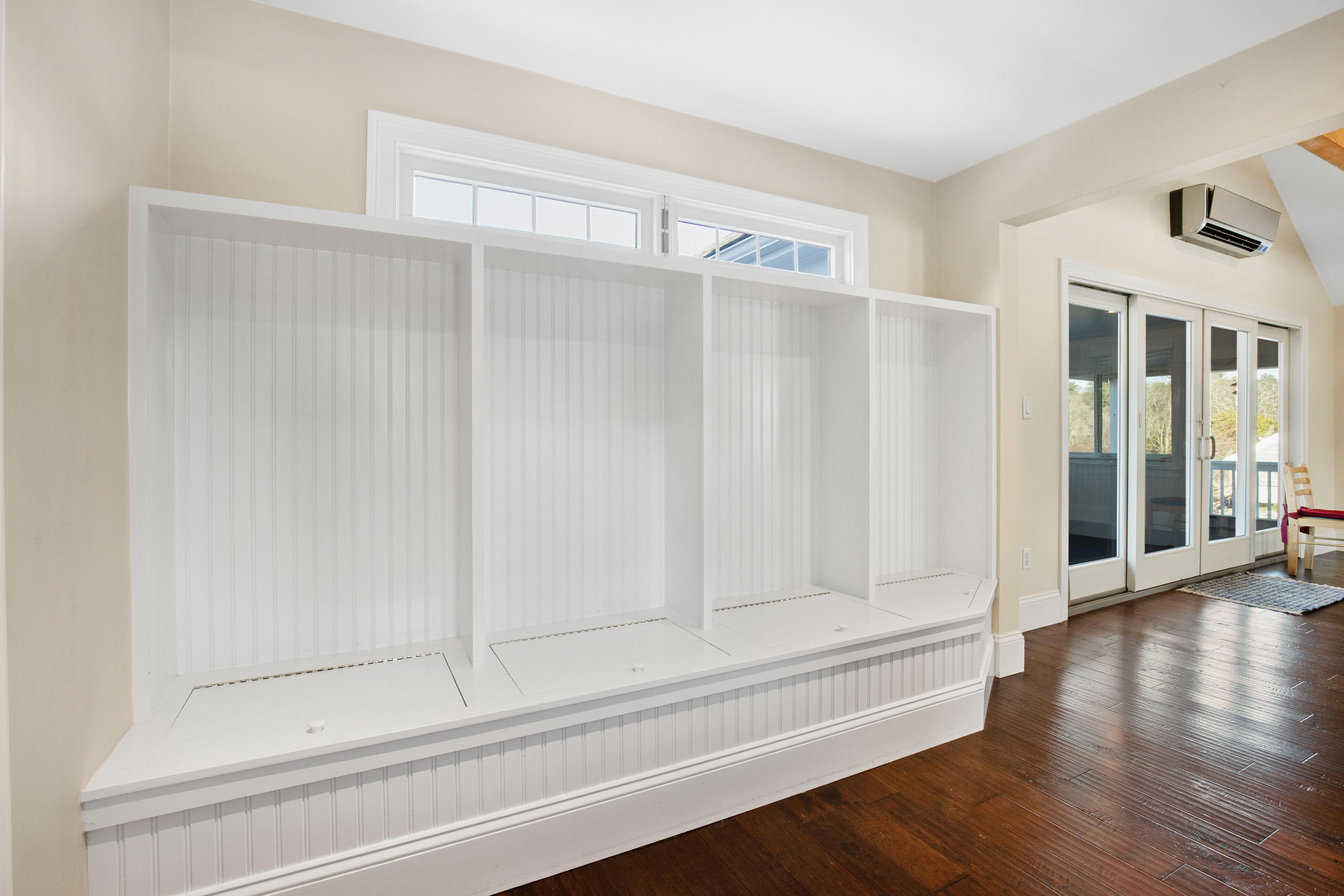 141 Bog Road Marstons Mills, MA 02648 - Photo 11 of 59 a view of an empty room with wooden floor and a window