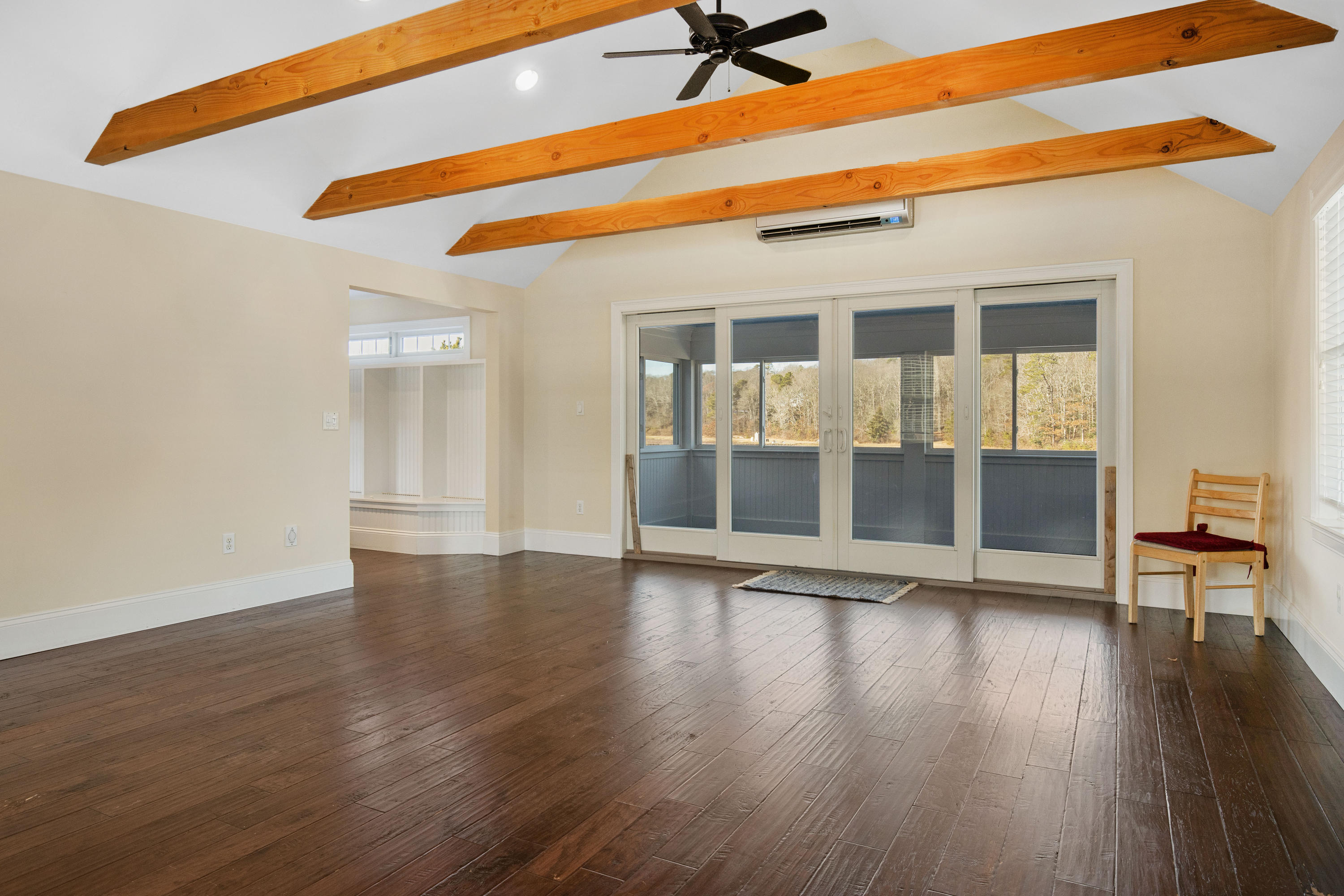 141 Bog Road Marstons Mills, MA 02648 - Photo 14 of 59 a view of empty room with wooden floor and fan