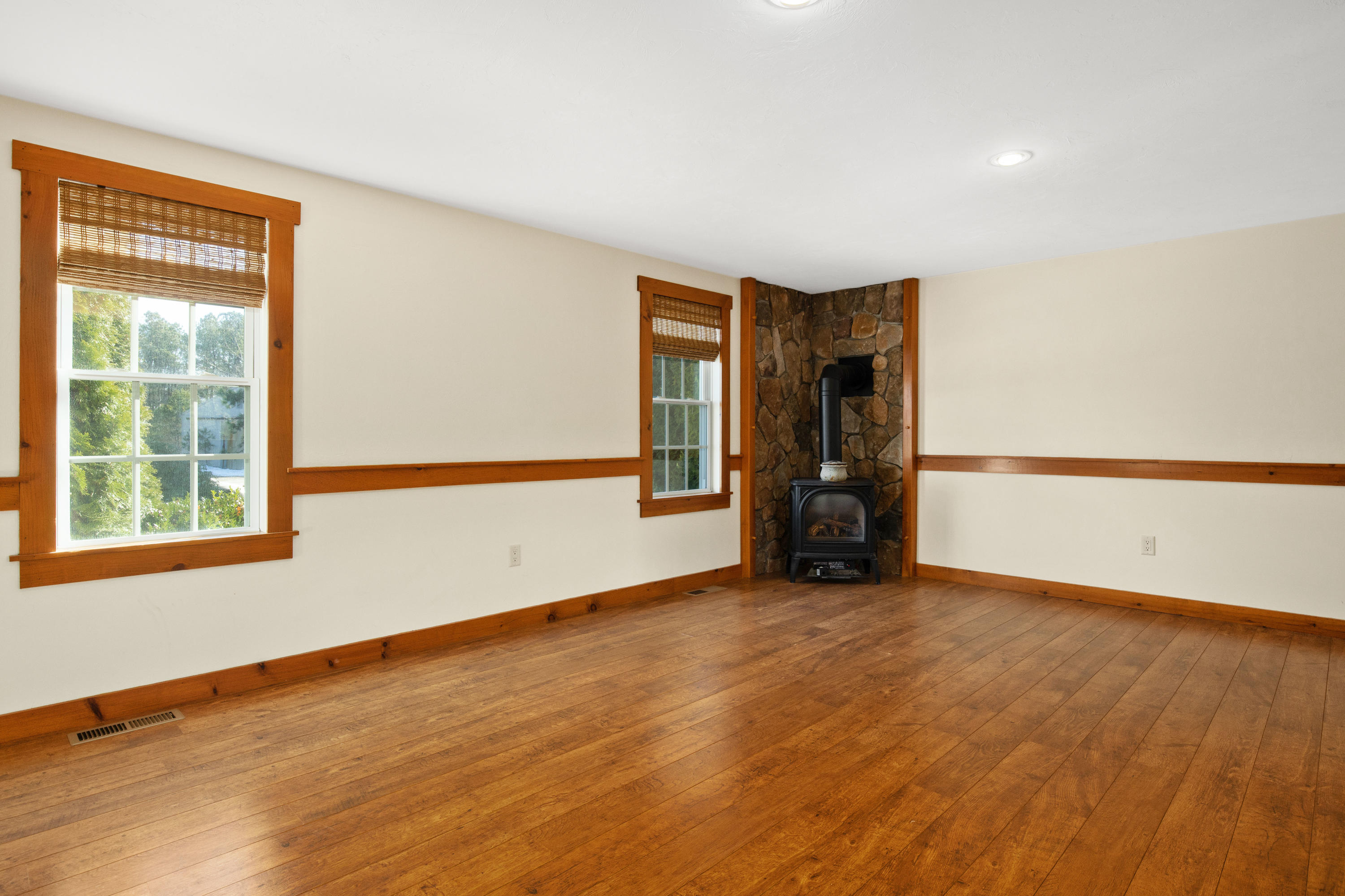141 Bog Road Marstons Mills, MA 02648 - Photo 22 of 59 a view of an empty room with wooden floor and a window