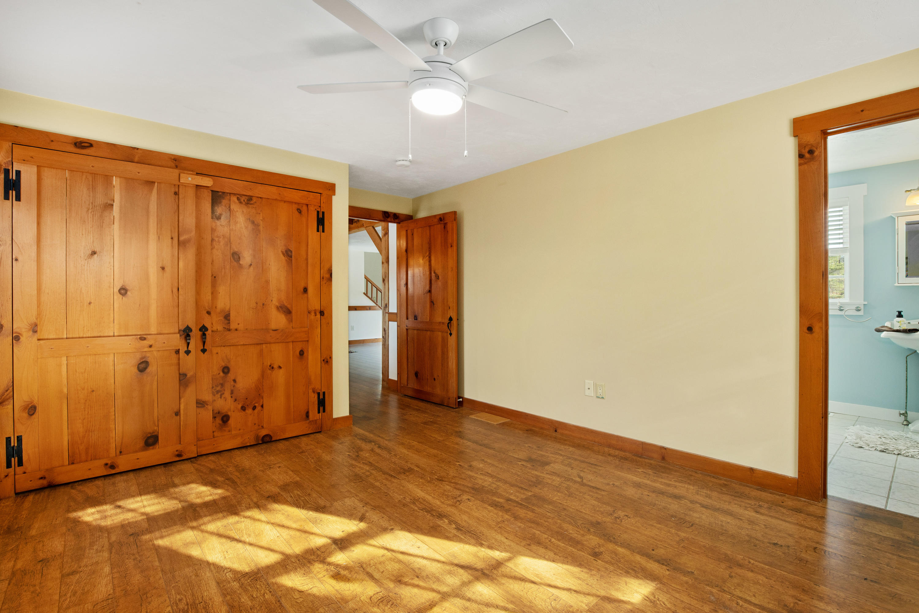 141 Bog Road Marstons Mills, MA 02648 - Photo 28 of 59 an empty room with wooden floor and closet area