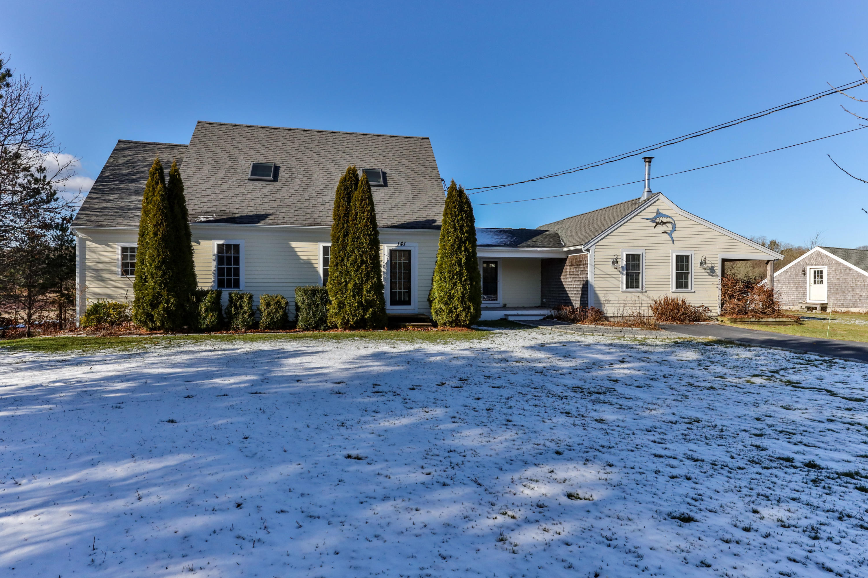 141 Bog Road Marstons Mills, MA 02648 - Photo 3 of 59 a front view of a house with a yard