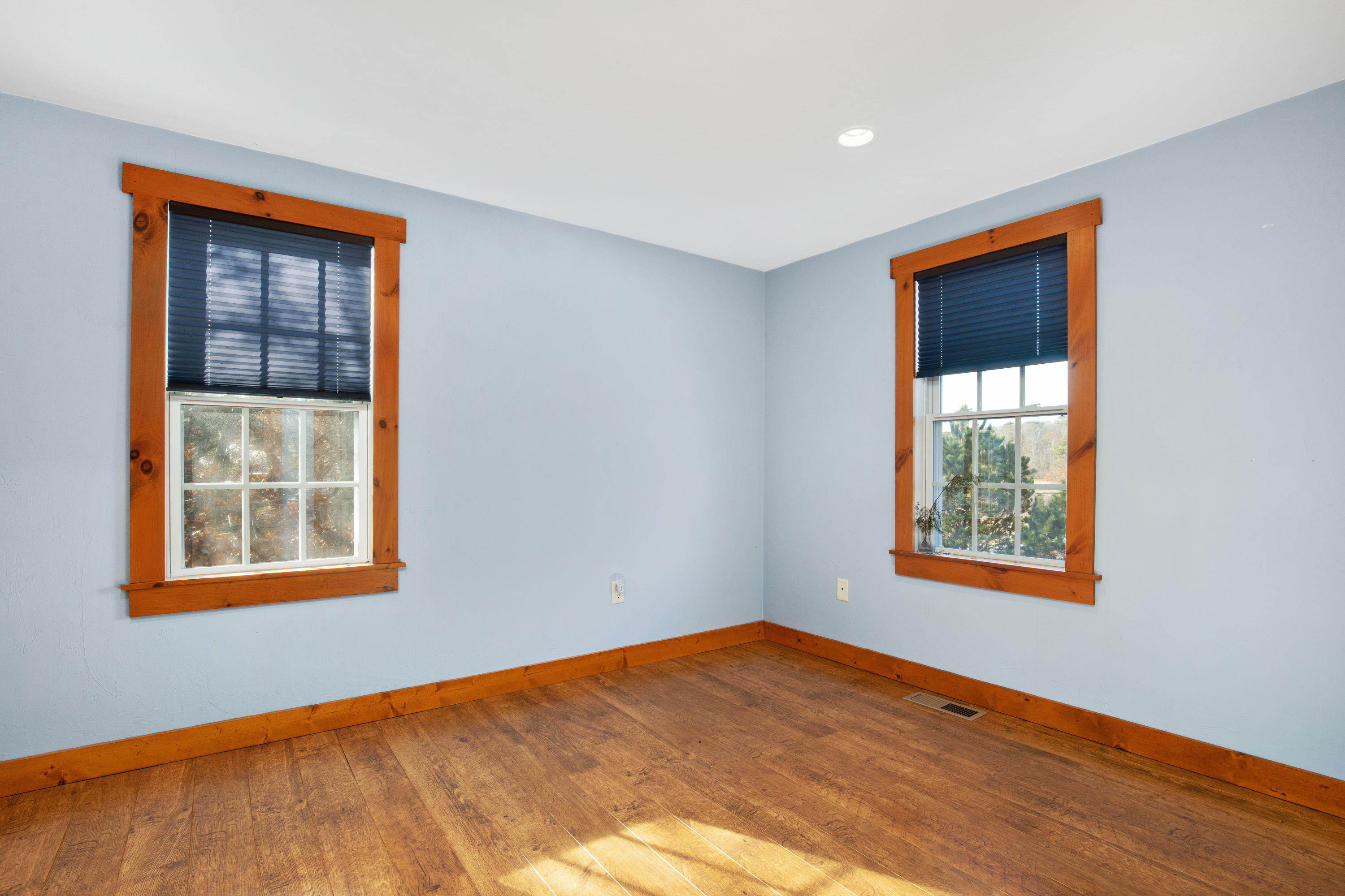 141 Bog Road Marstons Mills, MA 02648 - Photo 36 of 59 a view of an empty room with wooden floor and a window