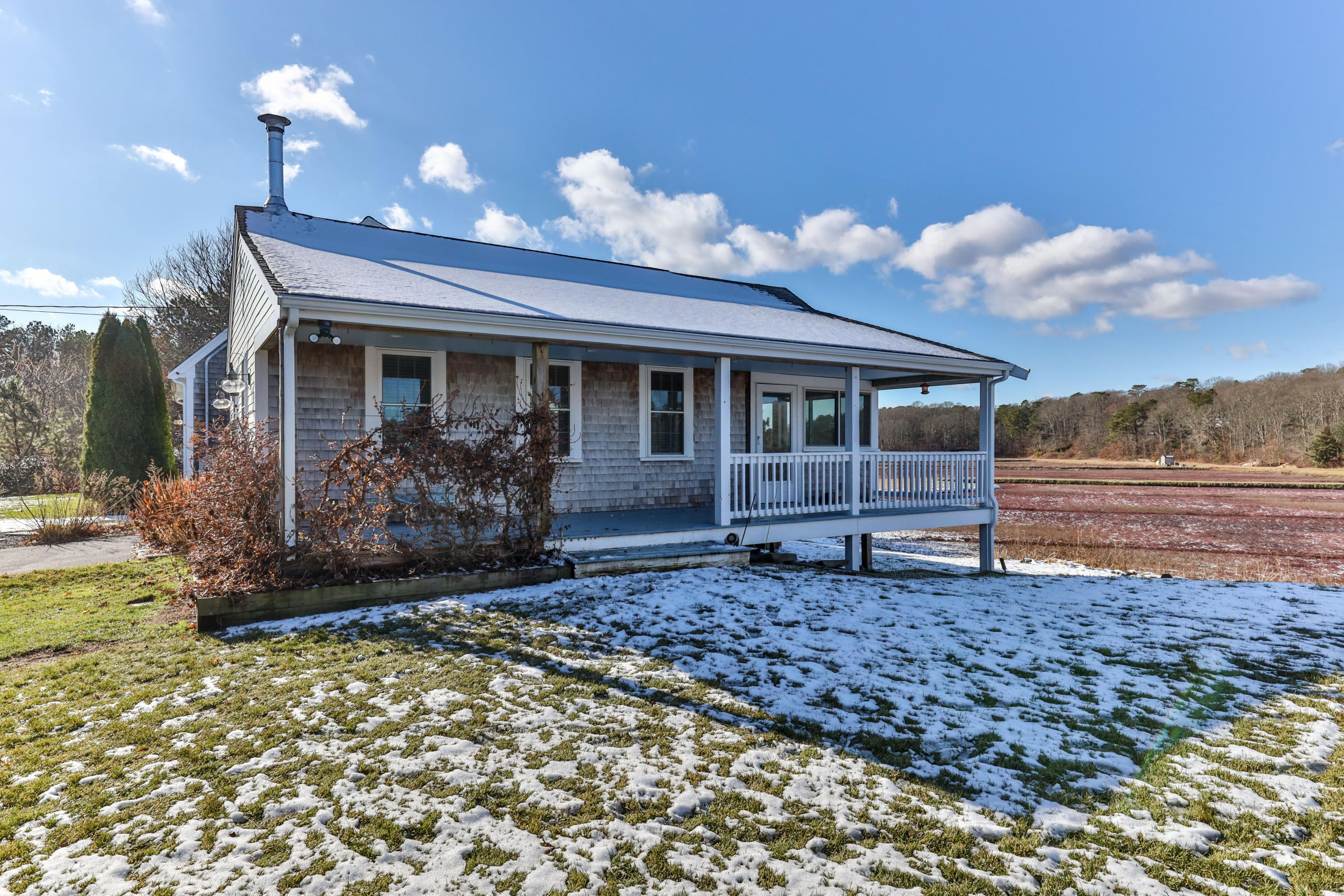 141 Bog Road Marstons Mills, MA 02648 - Photo 4 of 59 a front view of a house with a garden