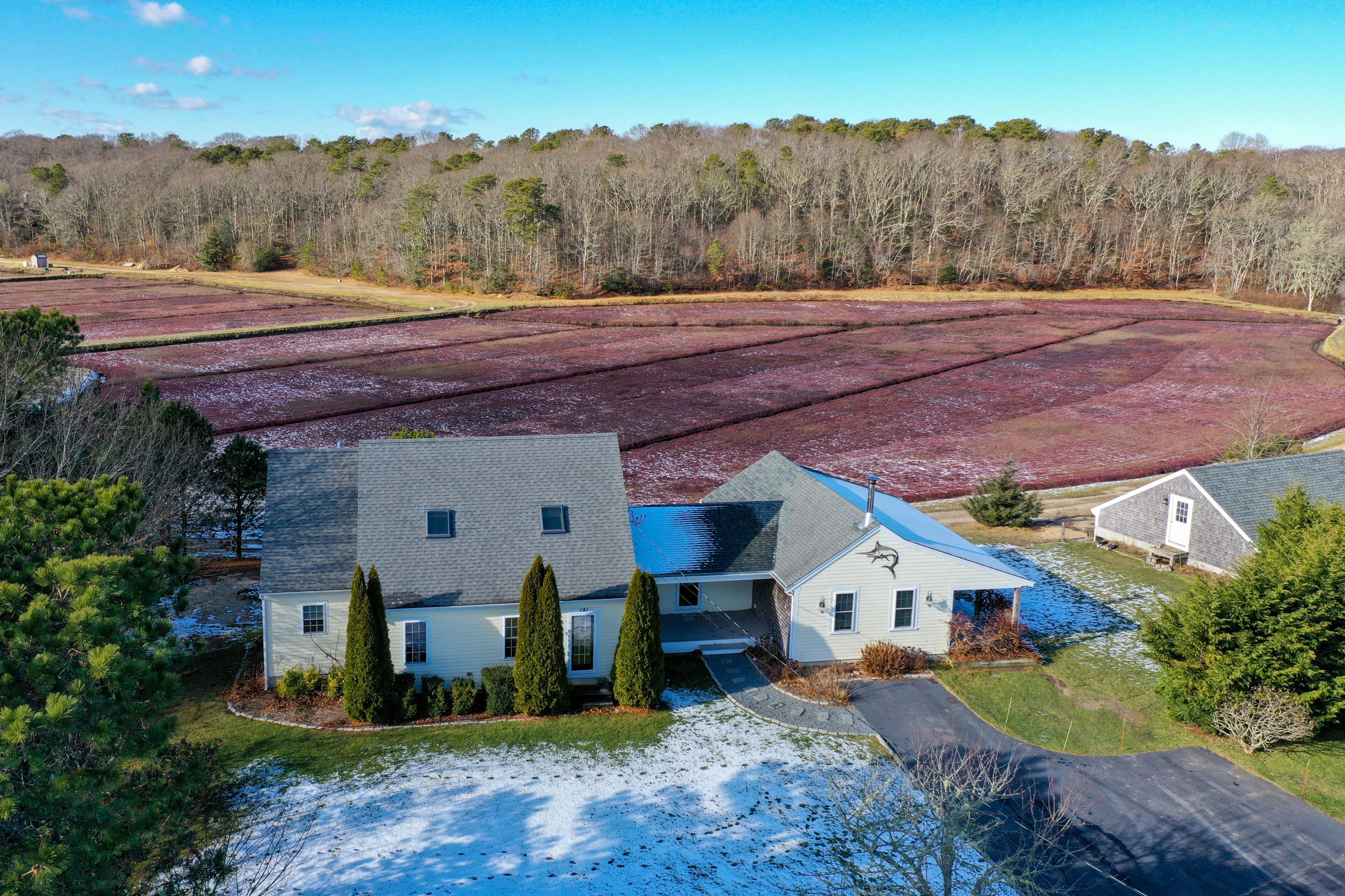 141 Bog Road Marstons Mills, MA 02648 - Photo 50 of 59 an aerial view of a house with a yard