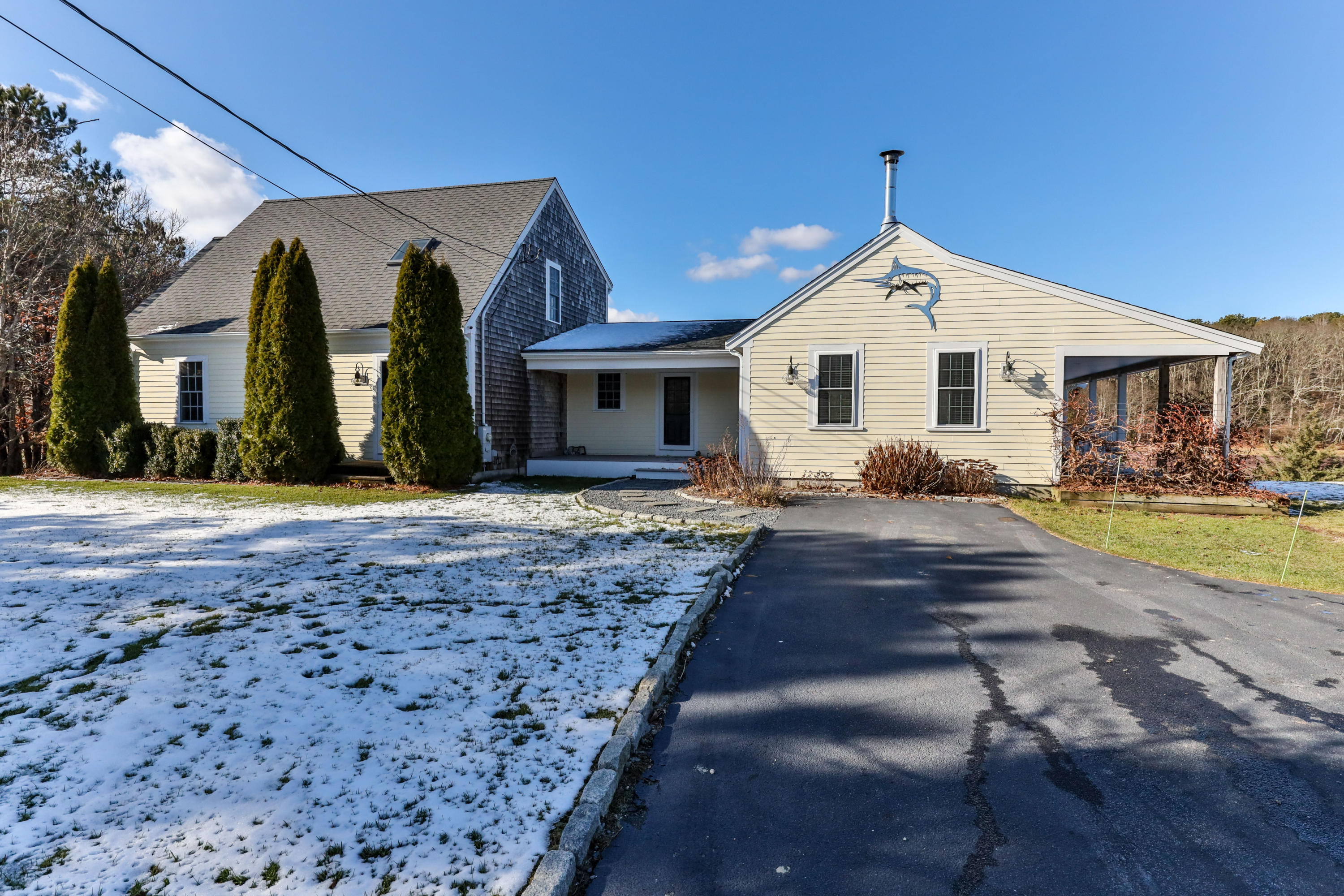 141 Bog Road Marstons Mills, MA 02648 - Photo 59 of 59 a front view of a house with a yard