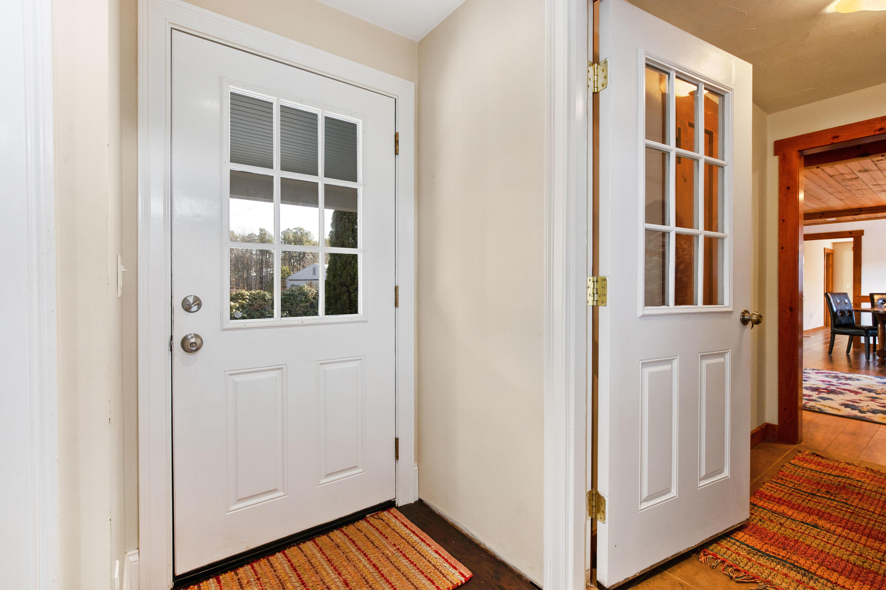 141 Bog Road Marstons Mills, MA 02648 - Photo 10 of 59 a view of an entryway with wooden floor and door