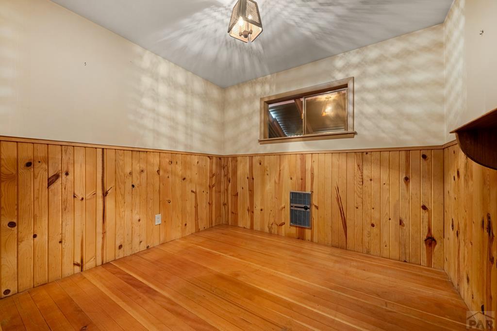 9600 Middle Creek Canyon Road Beulah, CO 81023 - Photo 31 of 50 a view of an empty room with wooden floor