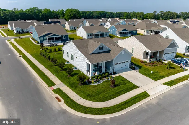 an aerial view of a house with a garden and plants