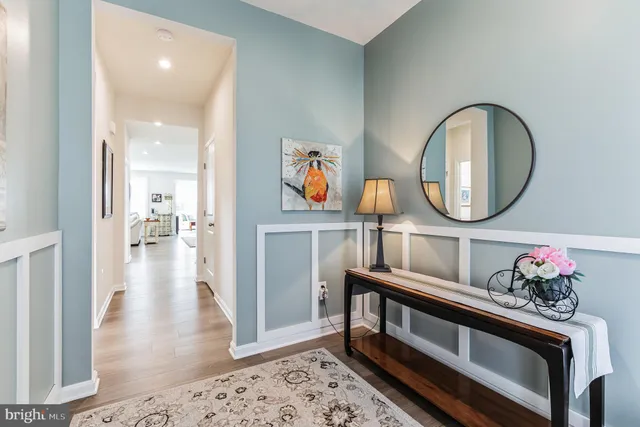 a view of living room and wooden floor
