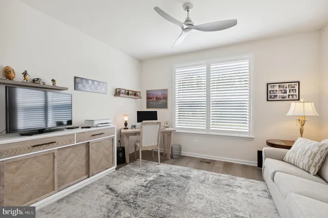 a workspace with furniture and window