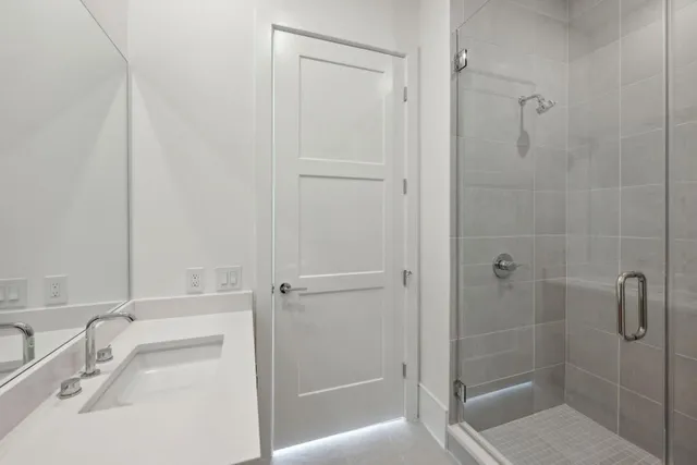a bathroom with a sink and shower
