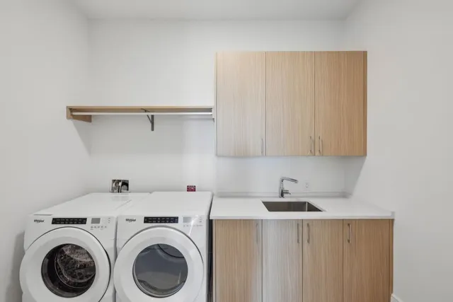 a view of storage and utility room with washer and dryer