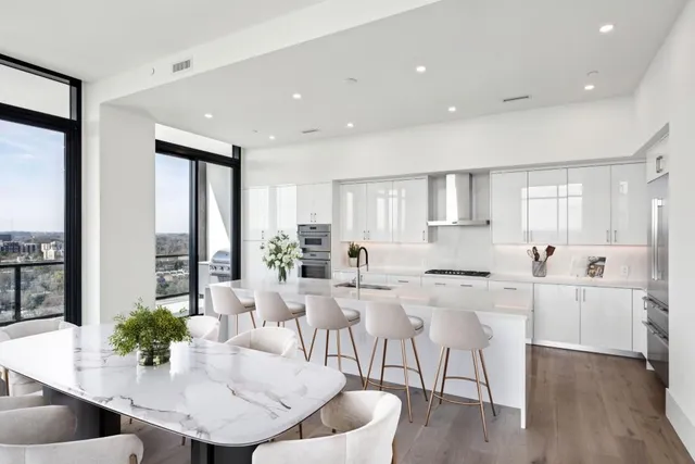a view of a dining room with furniture and wooden floor