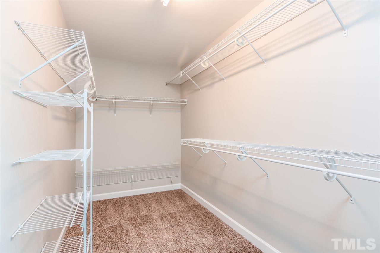 5336 Glass Ridge Road Raleigh, NC 27616 - Photo 14 of 21 a view of a room with racks on the wall