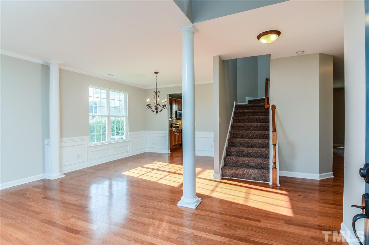 5336 Glass Ridge Road Raleigh, NC 27616 - Photo 3 of 21 a view of entryway with wooden floor and stair