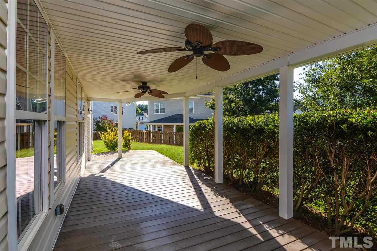 5336 Glass Ridge Road Raleigh, NC 27616 - Photo 5 of 21 a view of a porch with wooden floor