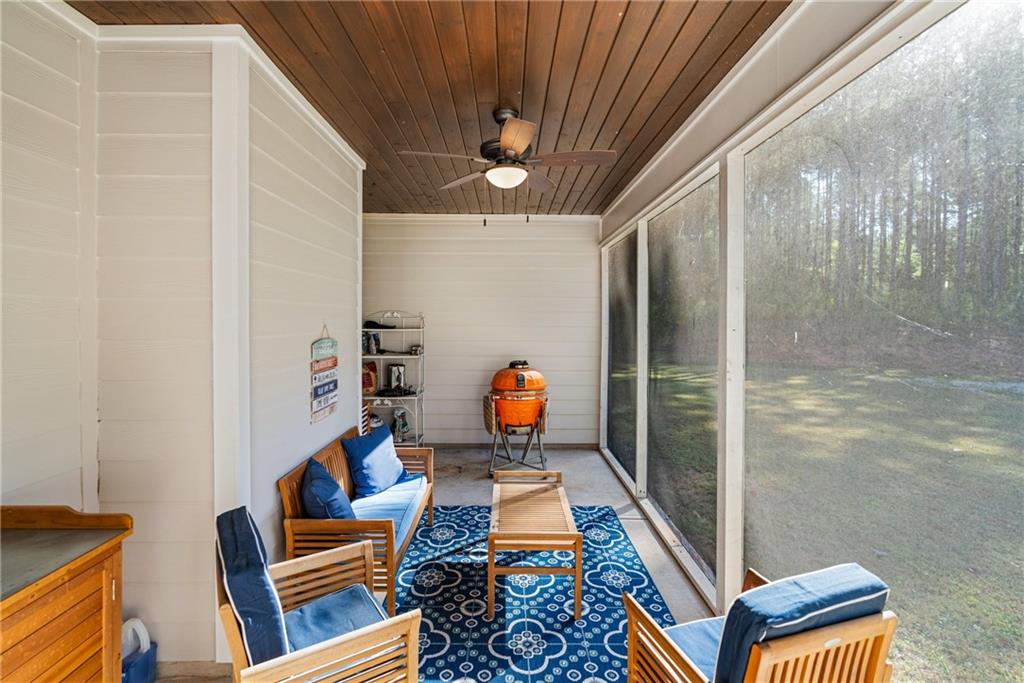 3696 Lee Road Salem, AL 36874 - Photo 33 of 36 Screened outdoor porch featuring a wood-finish ceiling, ceiling fan, and concrete flooring