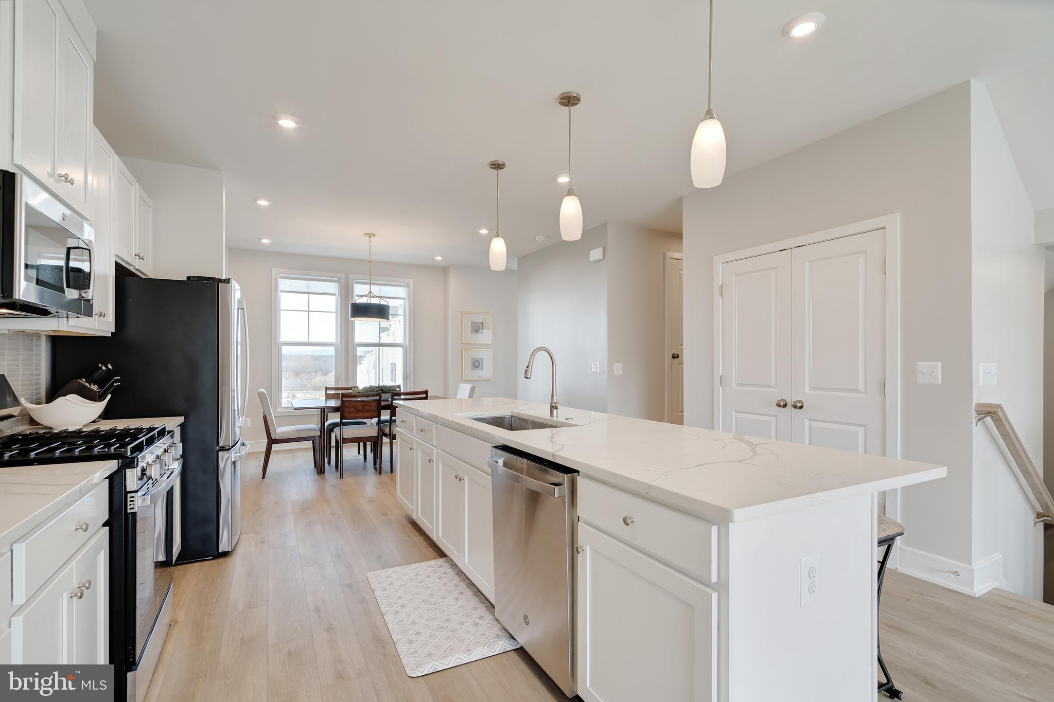 105 Checkerspot Way Front Royal, VA 22630 - Photo 16 of 39 a kitchen with counter top space sink stove and refrigerator