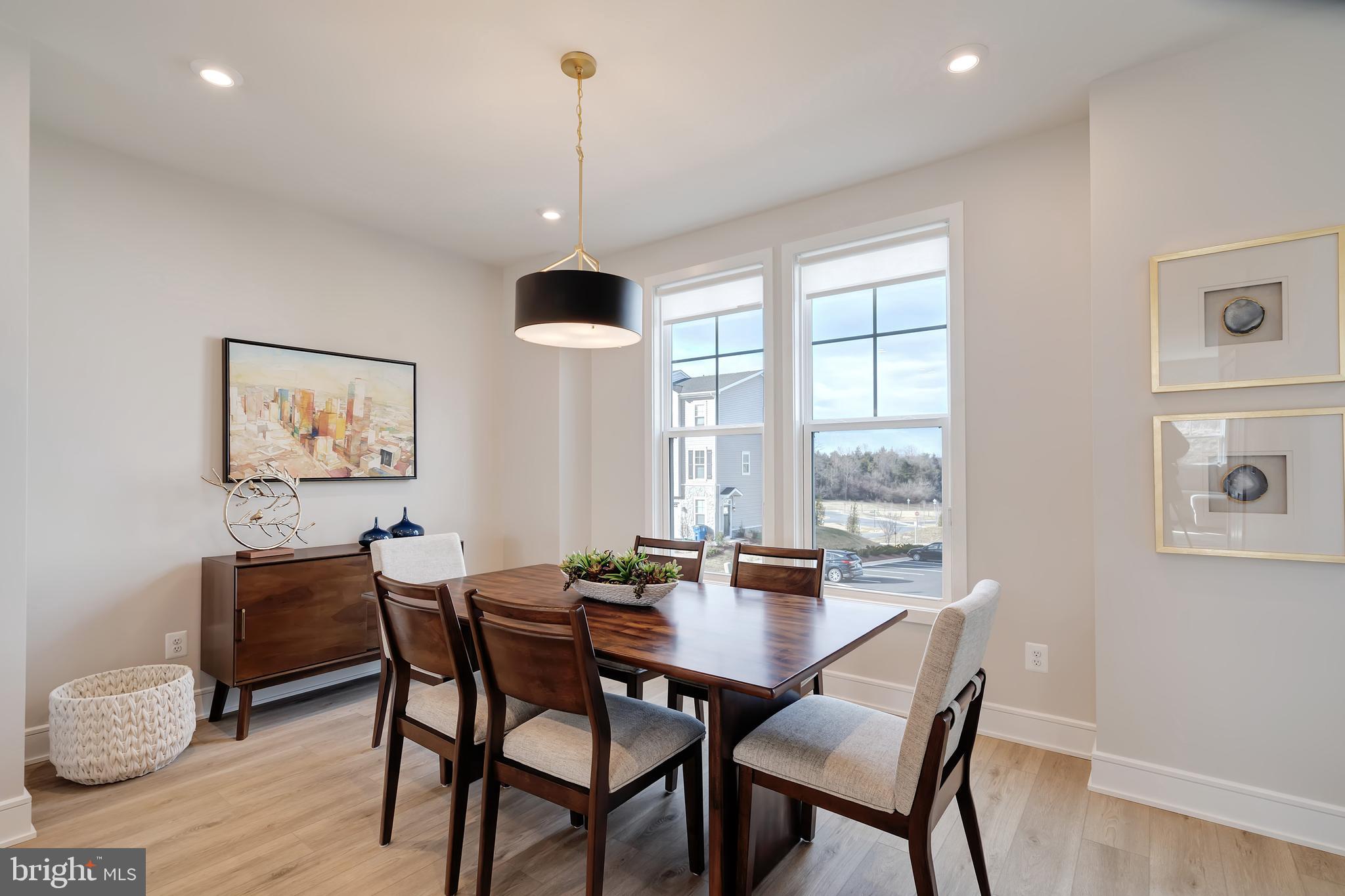 105 Checkerspot Way Front Royal, VA 22630 - Photo 18 of 39 a view of a dining room with furniture window and wooden floor