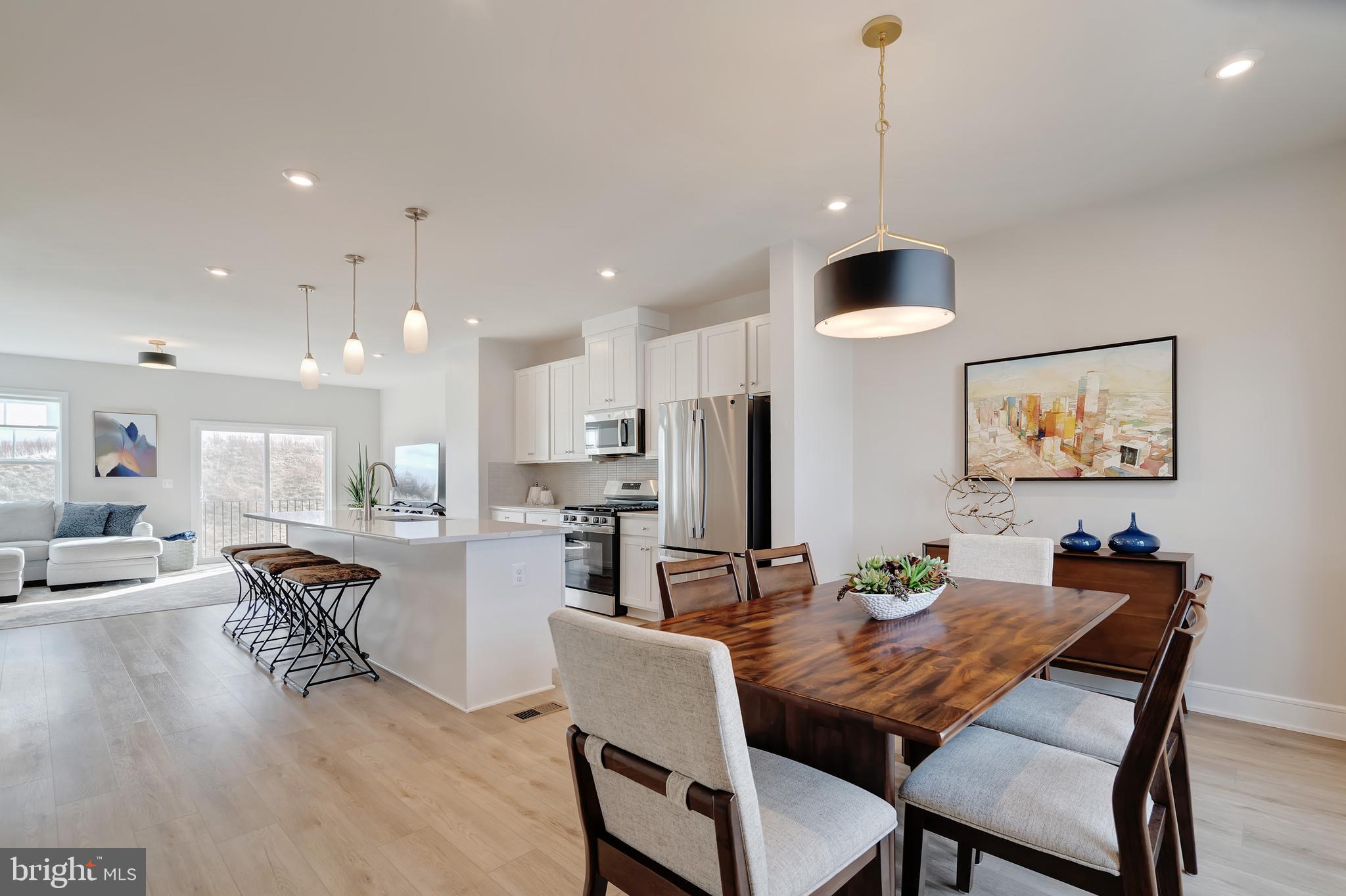 105 Checkerspot Way Front Royal, VA 22630 - Photo 20 of 39 a dining room with furniture a chandelier and kitchen view