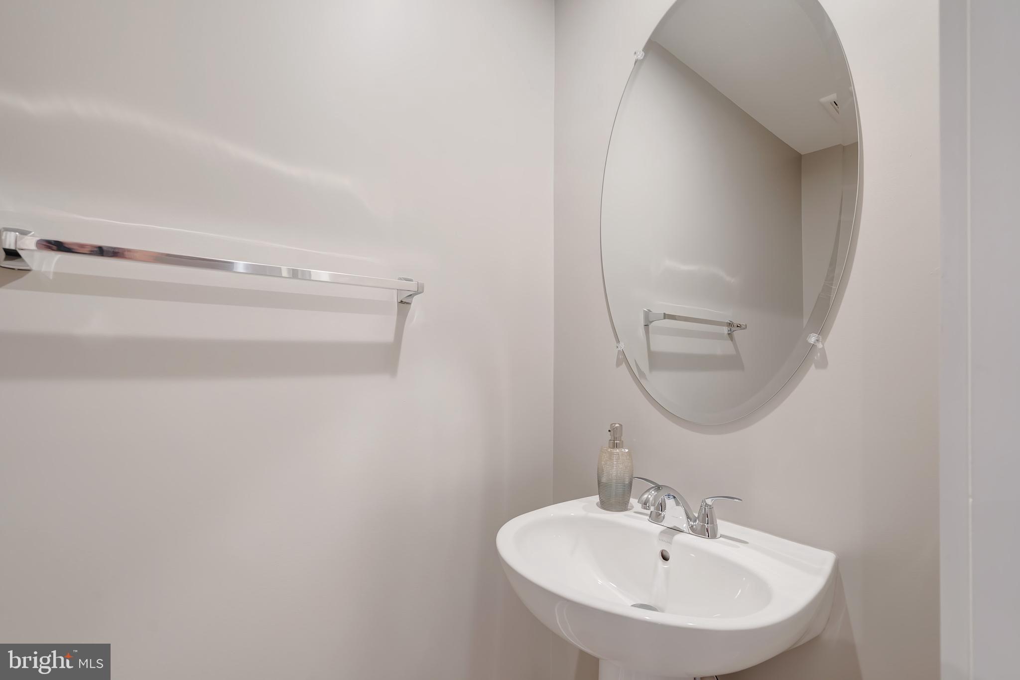 105 Checkerspot Way Front Royal, VA 22630 - Photo 22 of 39 a bathroom with a sink and a mirror