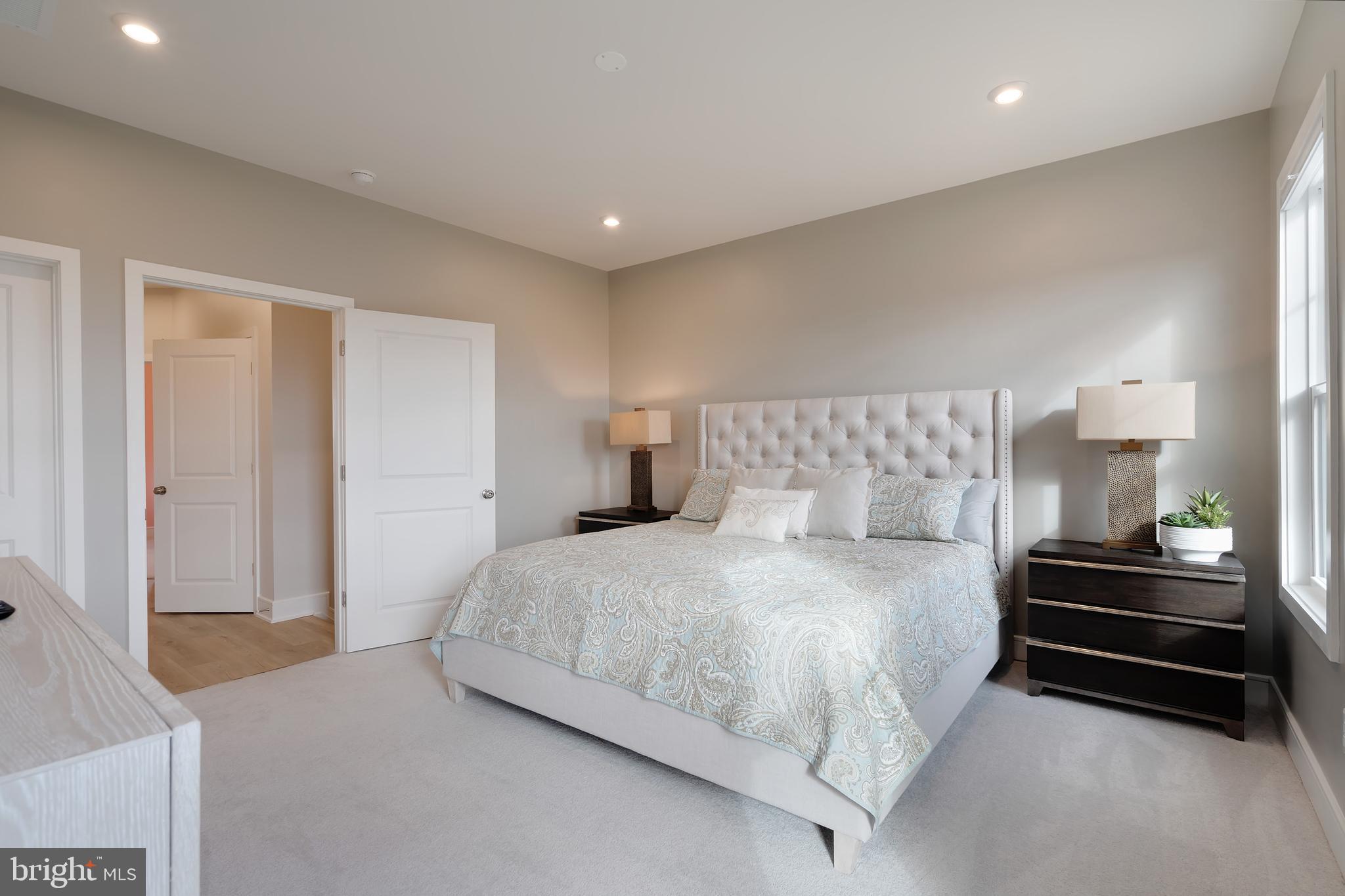 105 Checkerspot Way Front Royal, VA 22630 - Photo 24 of 39 a bedroom with a bed and a walk in closet