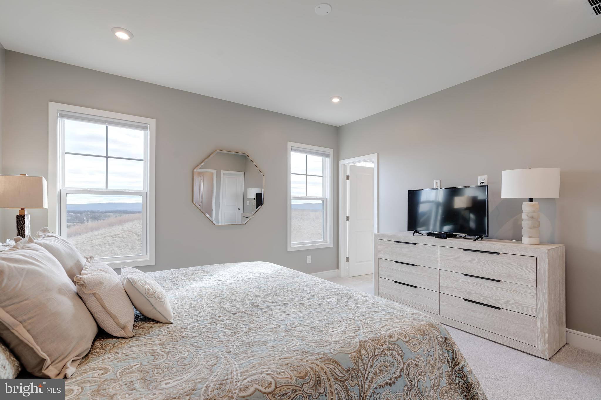 105 Checkerspot Way Front Royal, VA 22630 - Photo 25 of 39 a bedroom with a bed and a television