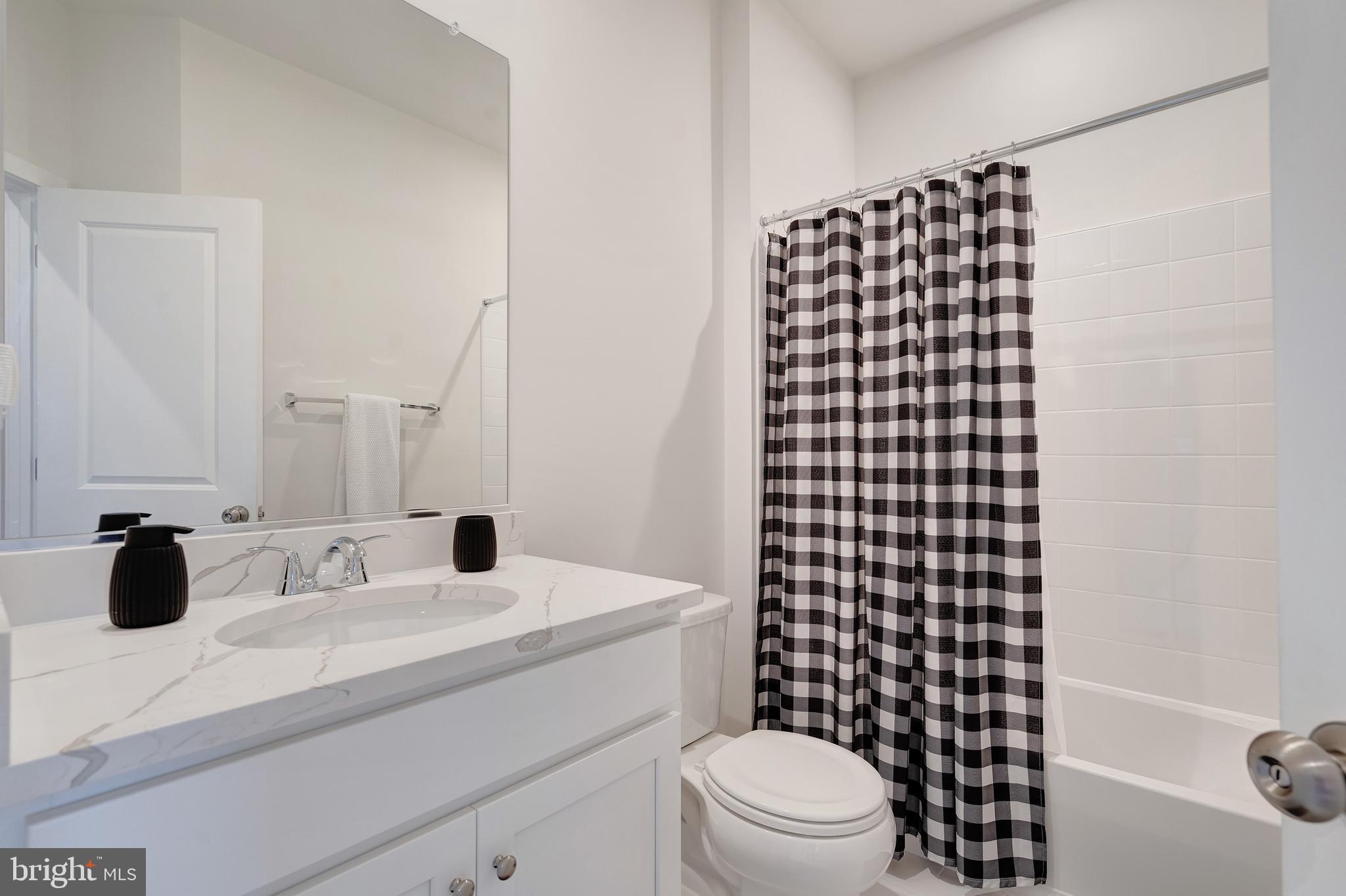 105 Checkerspot Way Front Royal, VA 22630 - Photo 30 of 39 a bathroom with a sink a toilet and shower