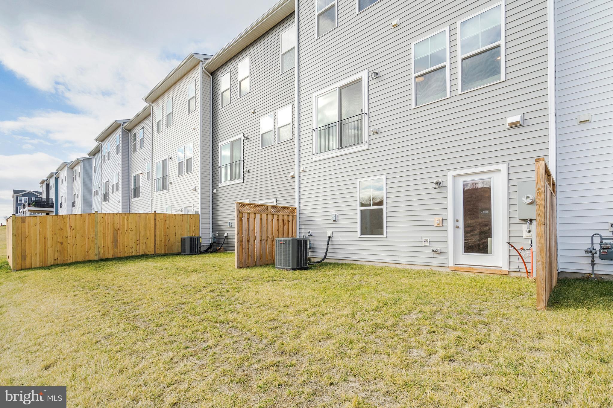 105 Checkerspot Way Front Royal, VA 22630 - Photo 34 of 39 a view of an house with backyard and tree