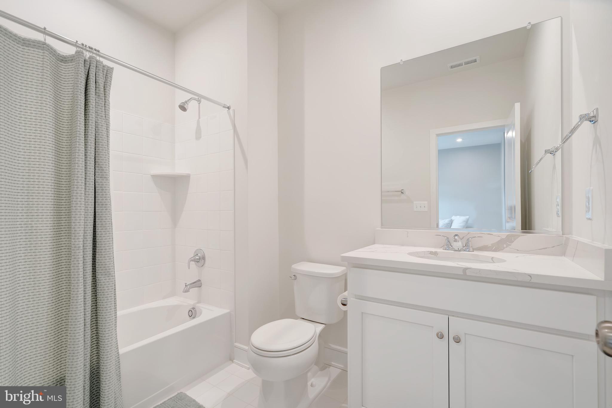105 Checkerspot Way Front Royal, VA 22630 - Photo 8 of 39 a bathroom with a sink mirror toilet and bathtub