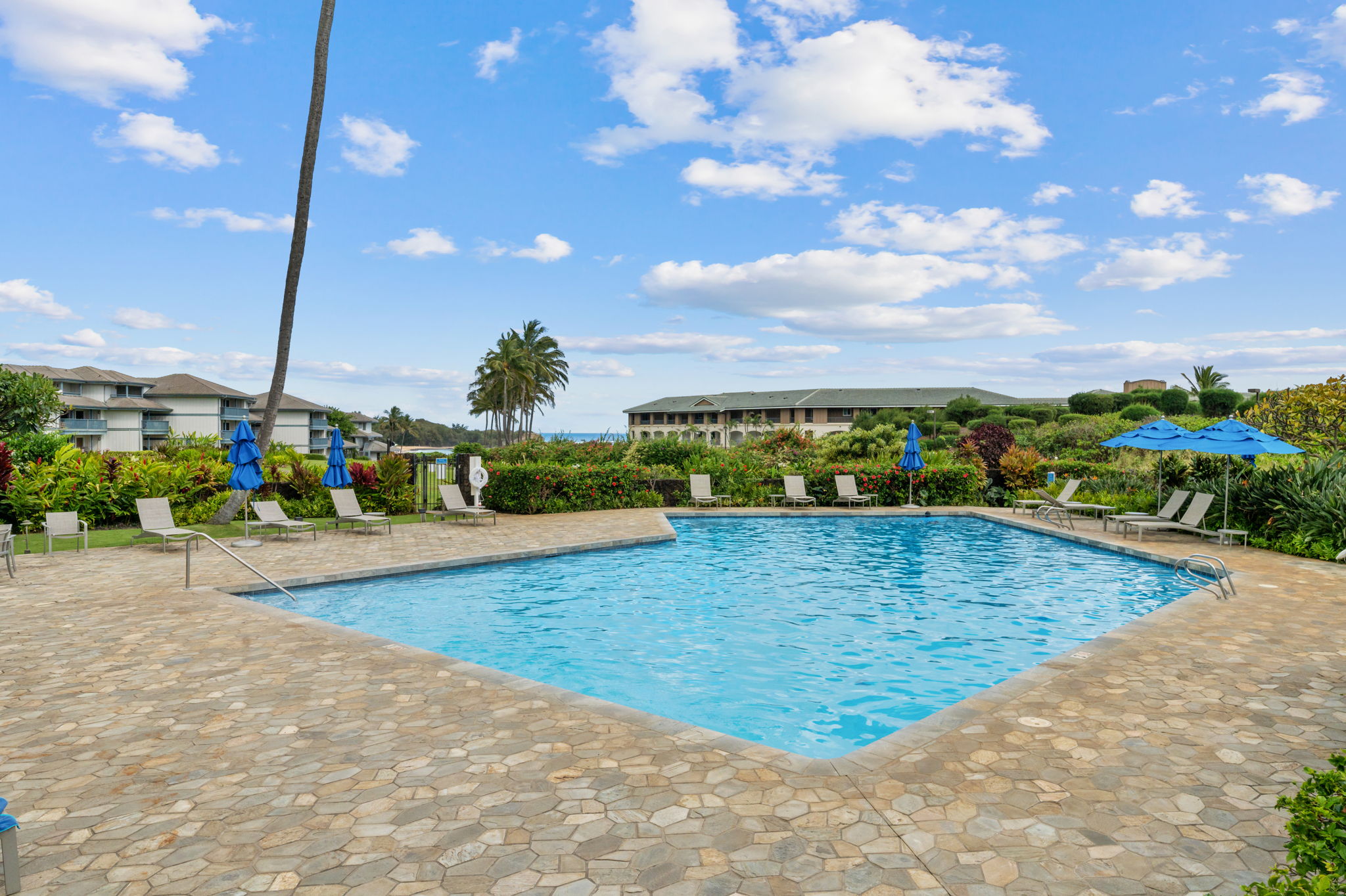 1565 Pe'e Road, Unit 418 Koloa, HI 96756 - Photo 20 of 30 a view of a swimming pool with an outdoor seating