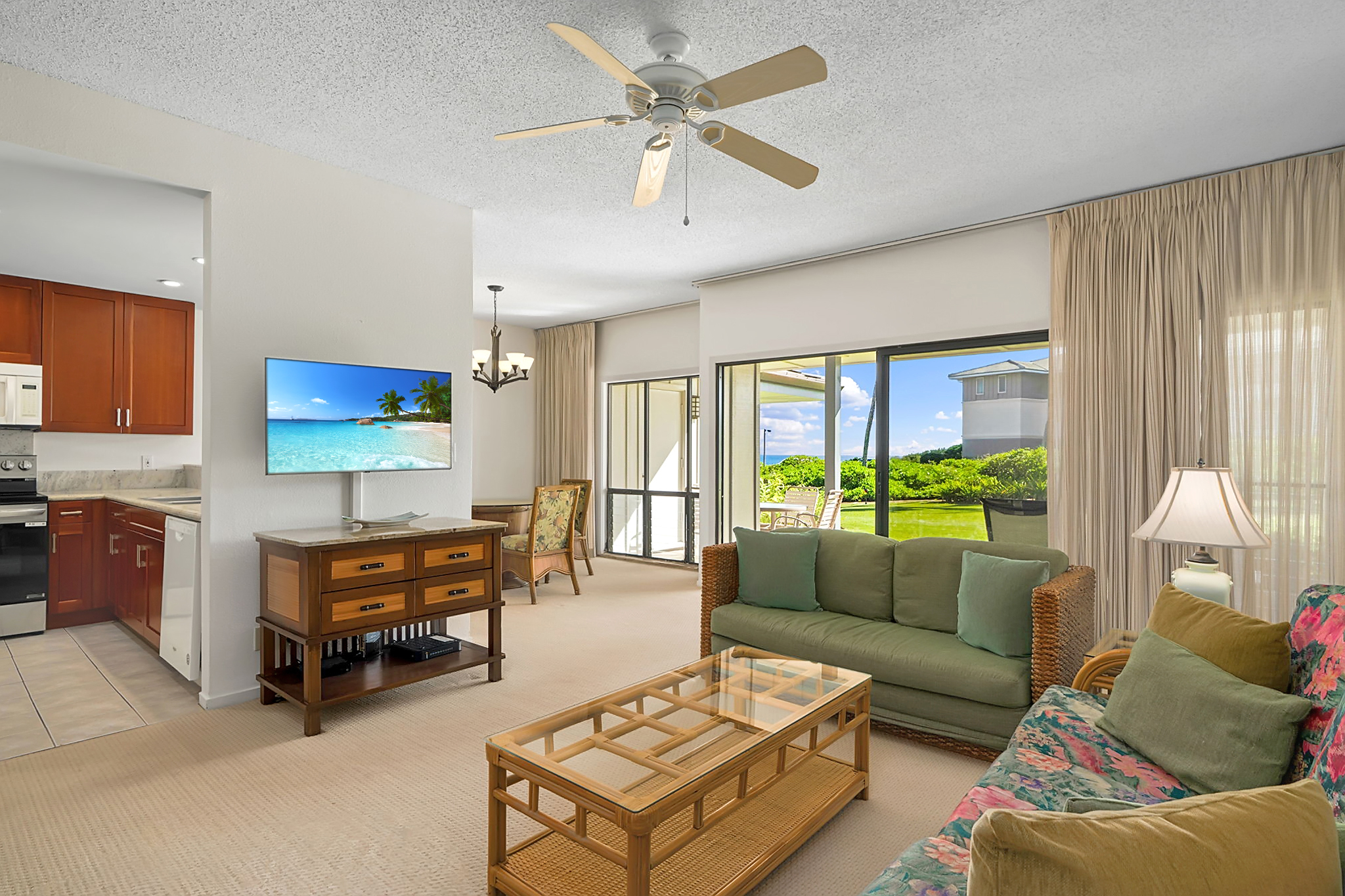 1565 Pe'e Road, Unit 418 Koloa, HI 96756 - Photo 8 of 30 a living room with furniture a ceiling fan and a window