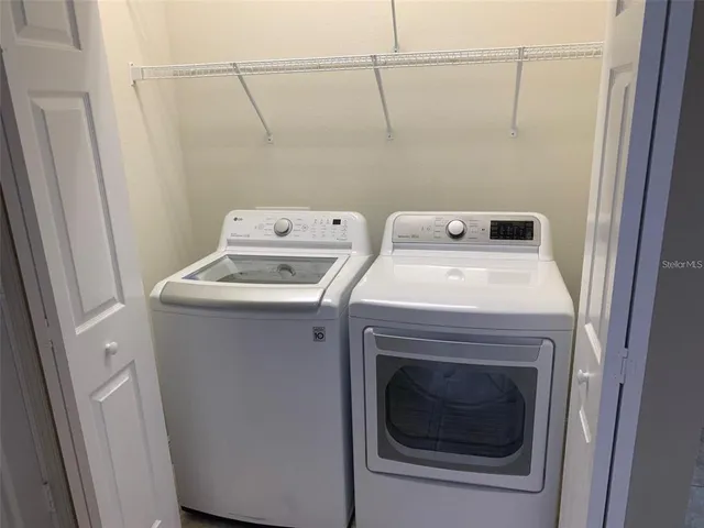 a utility room with dryer and washer