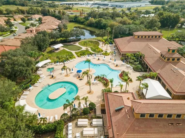 an aerial view of a house with a swimming pool