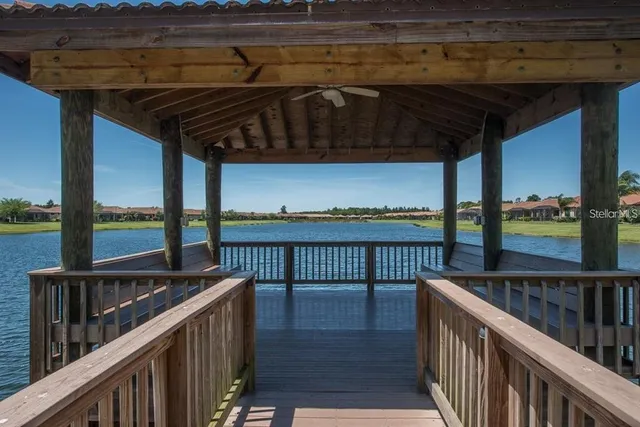 a view of a balcony with wooden floor