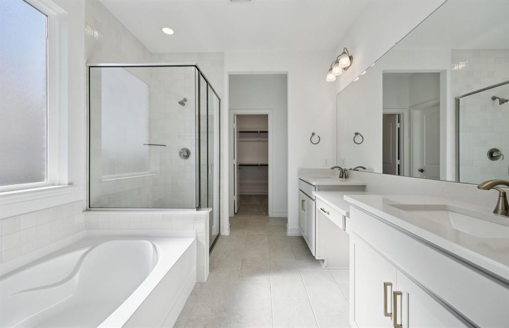 1713 Grace Street Anna, TX 75409 - Photo 13 of 22 Owner's bath designed with a double vanity and oversized tub