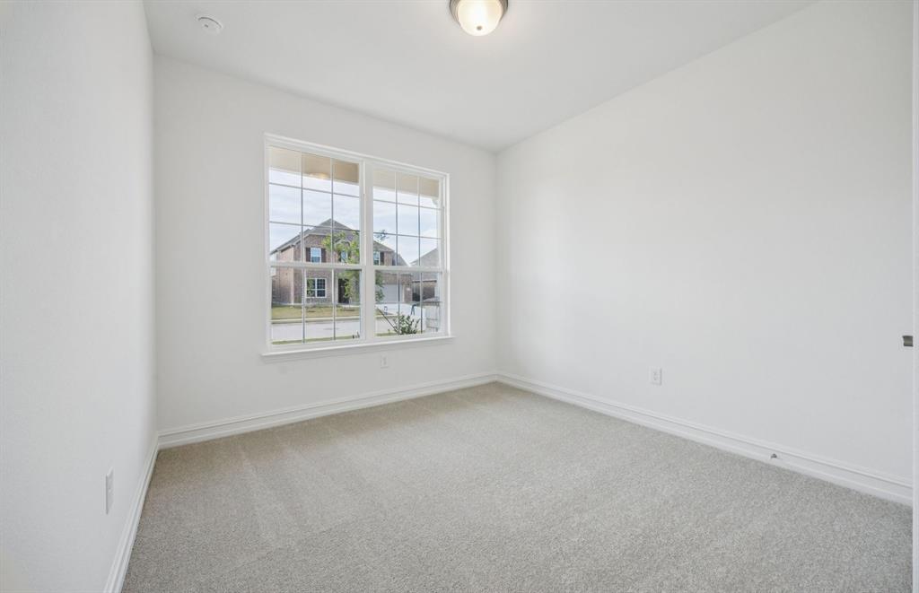 1713 Grace Street Anna, TX 75409 - Photo 16 of 22 Comfortable bedroom with a bright window view