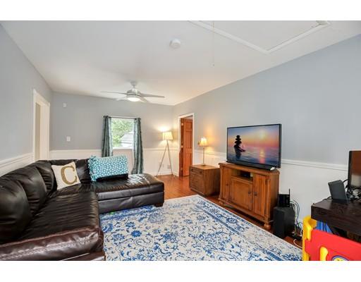 65 Barnett Road Sutton, MA 01590 - Photo 18 of 23 a living room with furniture and a flat screen tv