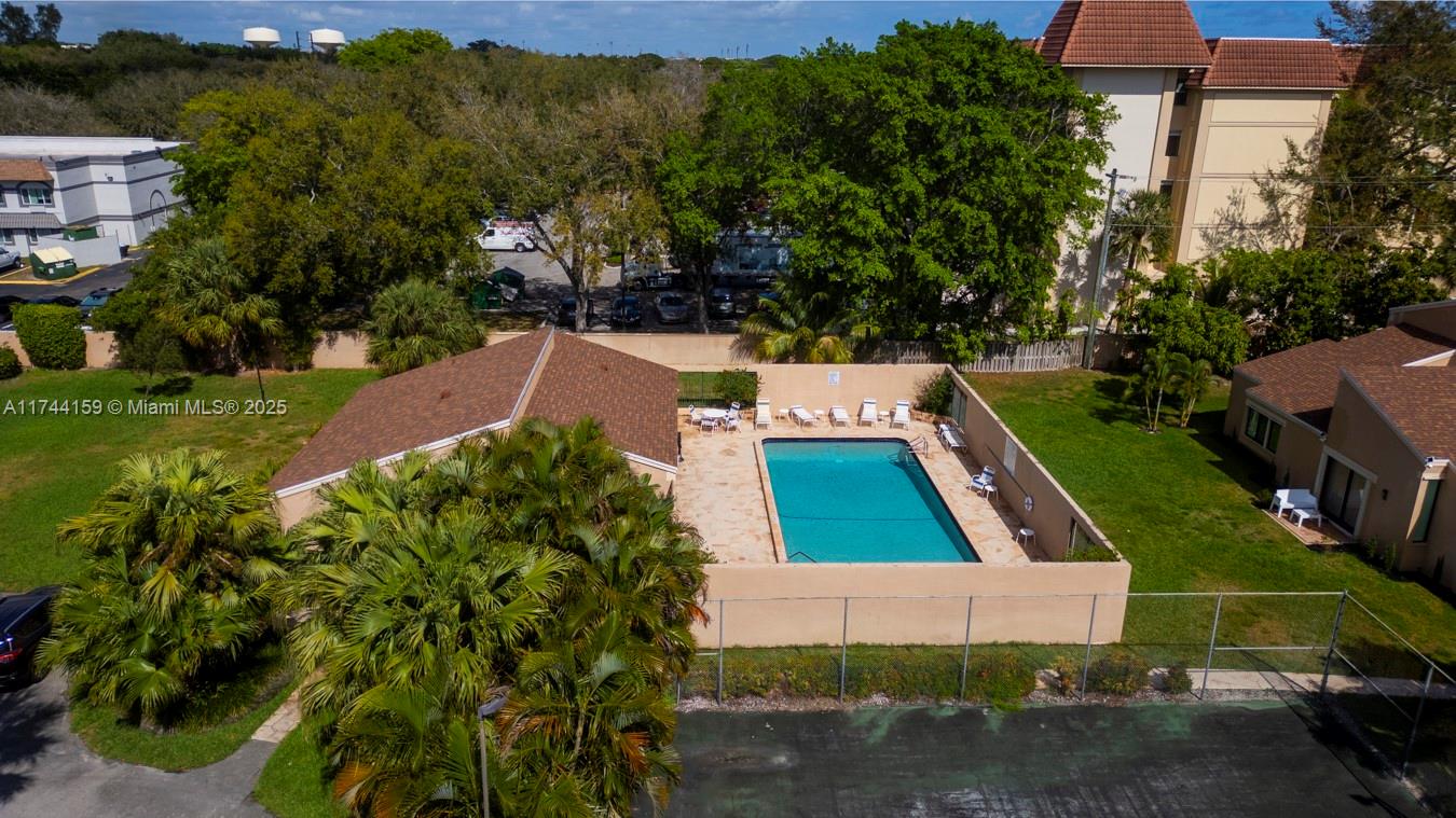 1161 Northwest 13th Street, Unit 4 Boca Raton, FL 33486 - Photo 27 of 39 an aerial view of house with yard swimming pool and outdoor seating