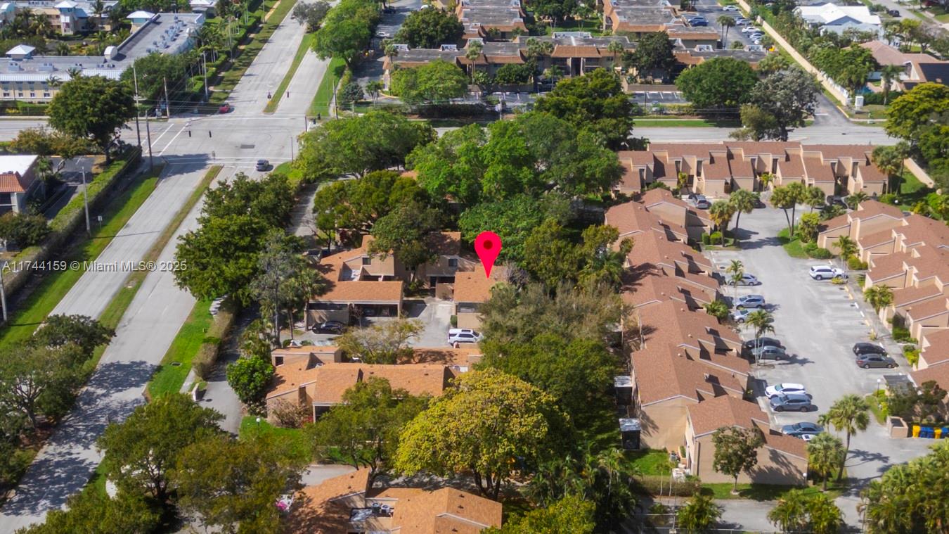 1161 Northwest 13th Street, Unit 4 Boca Raton, FL 33486 - Photo 30 of 39 an aerial view of residential houses with outdoor space