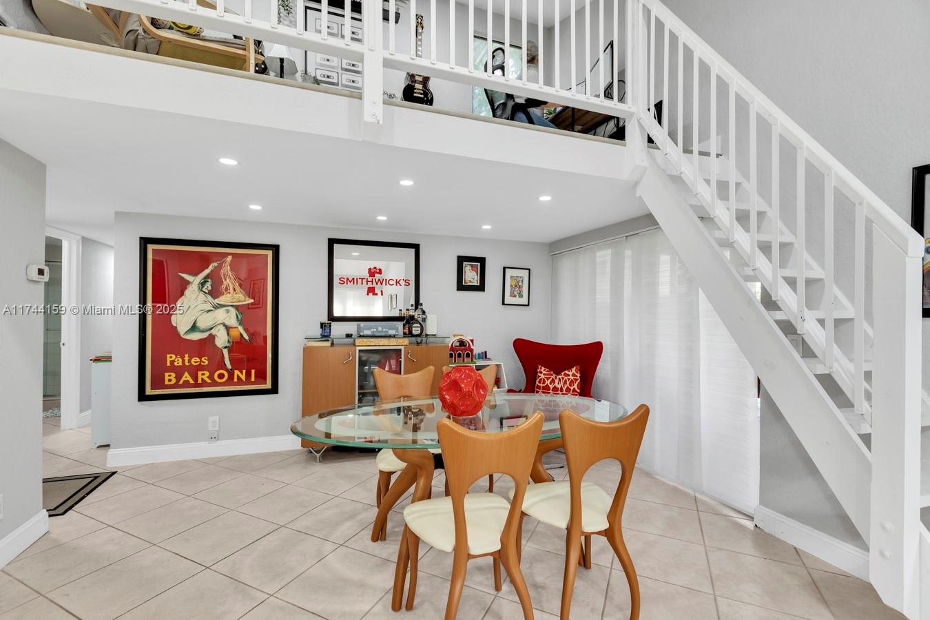 1161 Northwest 13th Street, Unit 4 Boca Raton, FL 33486 - Photo 3 of 39 a living room with furniture and stairs