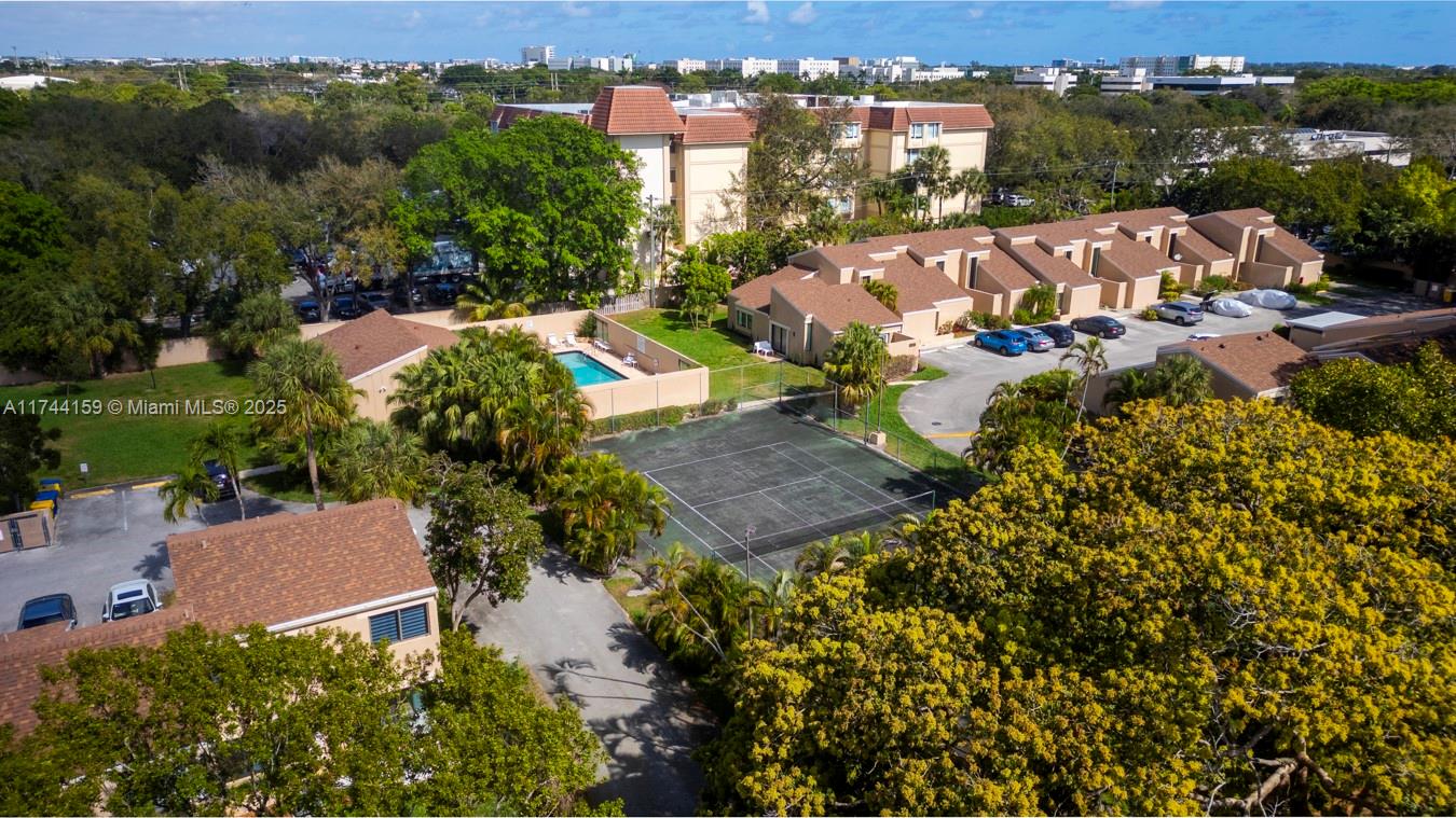 1161 Northwest 13th Street, Unit 4 Boca Raton, FL 33486 - Photo 36 of 39 an aerial view of a house with garden space and street view