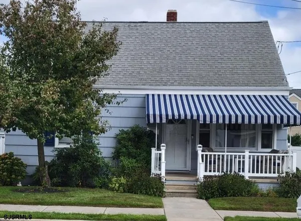 front view of a house with a garden