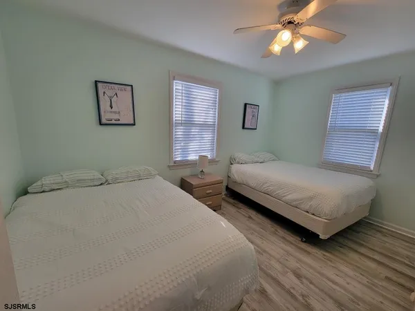 a bedroom with double bed and a window