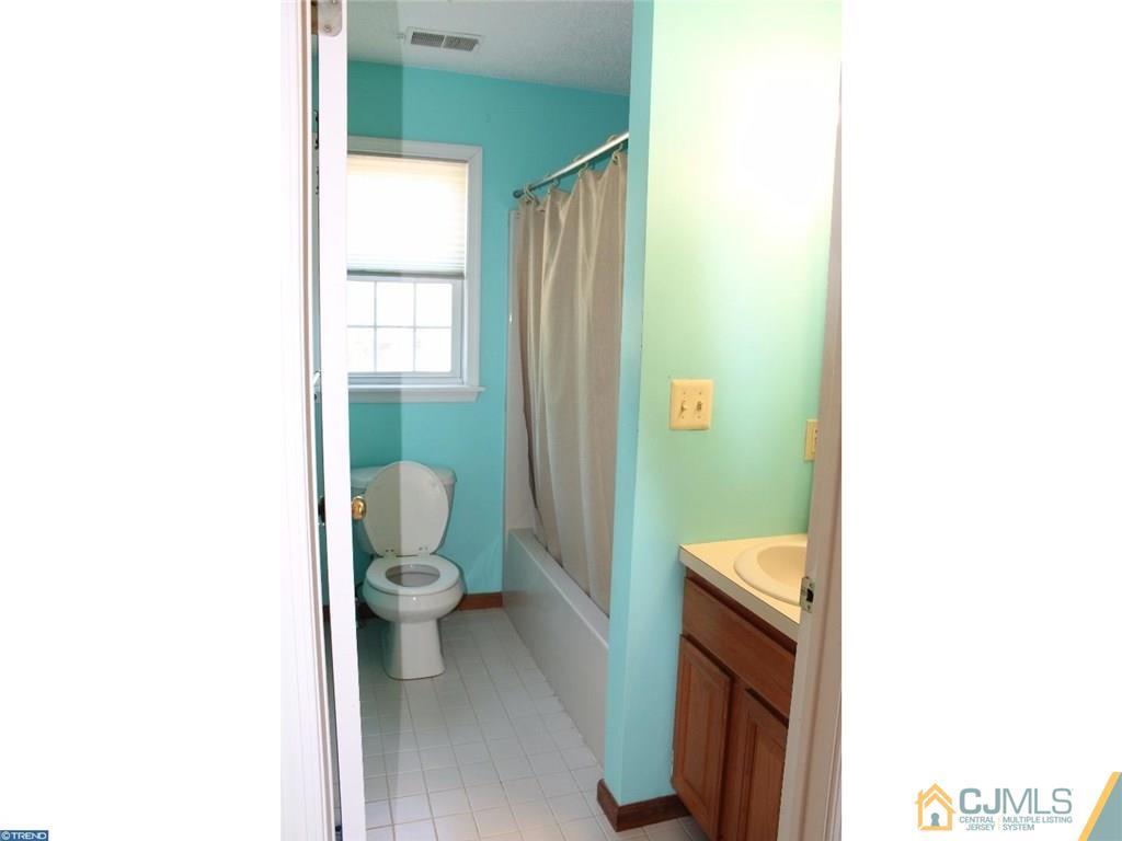 460 Flock Road Hamilton, NJ 08619 - Photo 16 of 25 a bathroom with a toilet and a sink