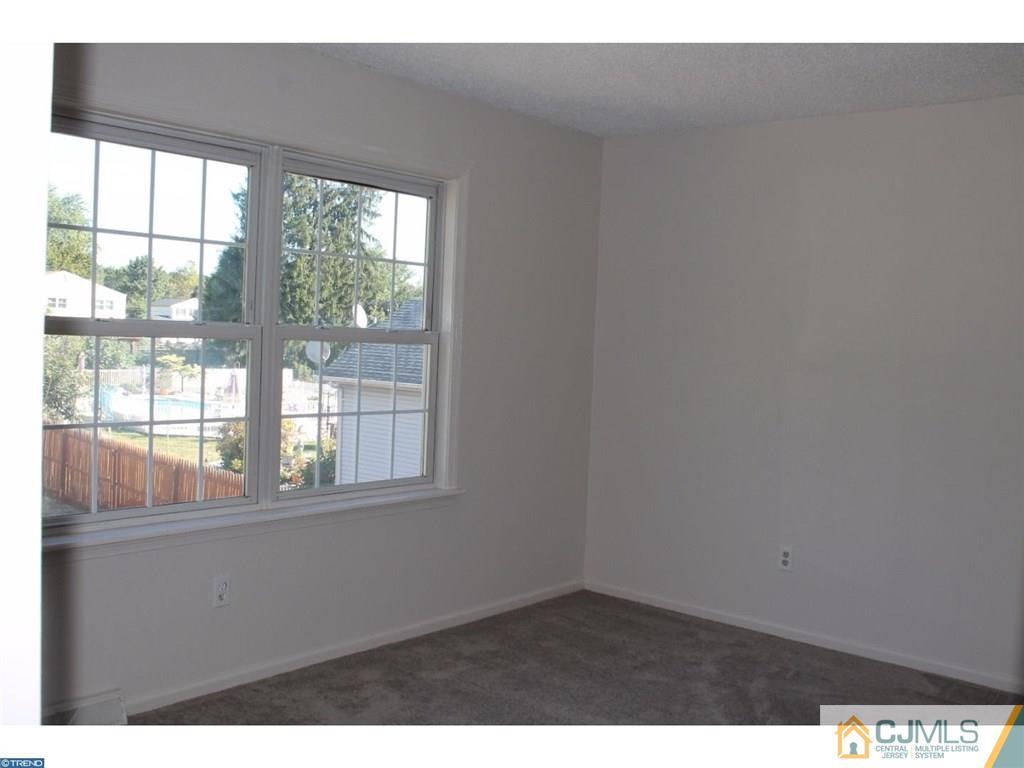 460 Flock Road Hamilton, NJ 08619 - Photo 17 of 25 a view of an empty room with a window