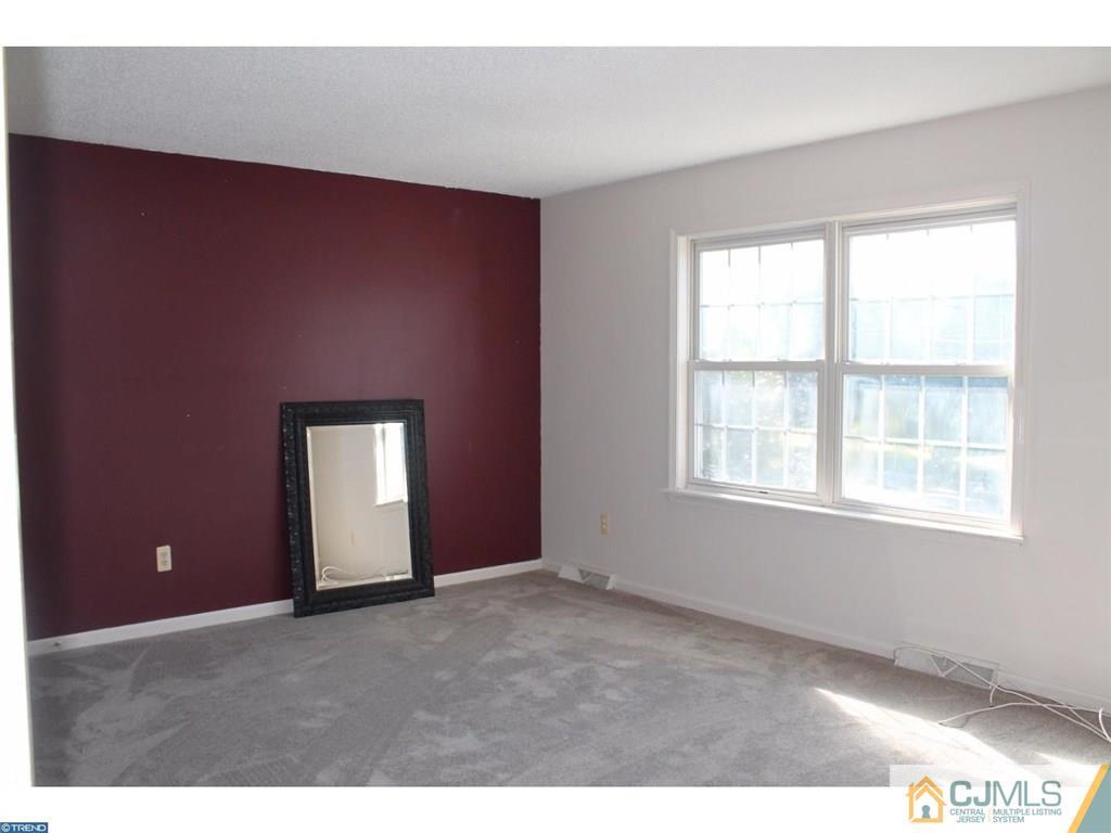 460 Flock Road Hamilton, NJ 08619 - Photo 18 of 25 a view of an empty room with a window