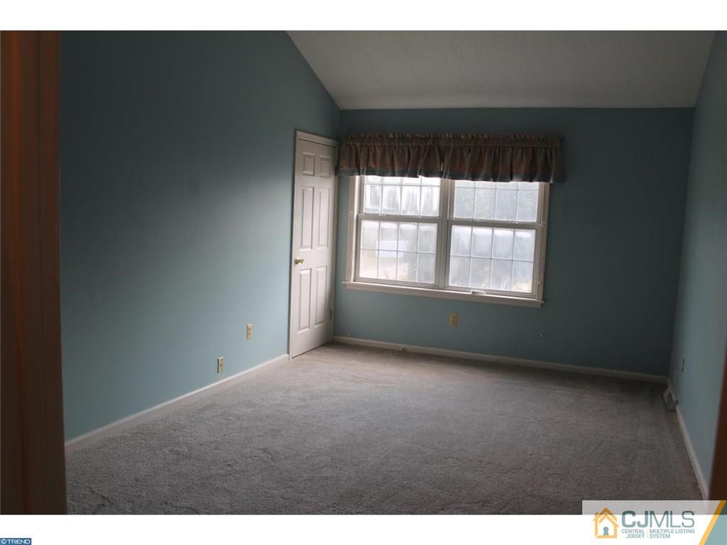 460 Flock Road Hamilton, NJ 08619 - Photo 22 of 25 a view of an empty room with a window