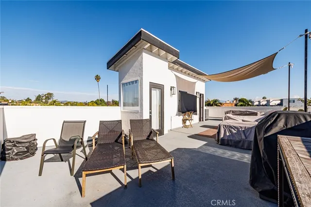 a view of a chairs and table in a patio