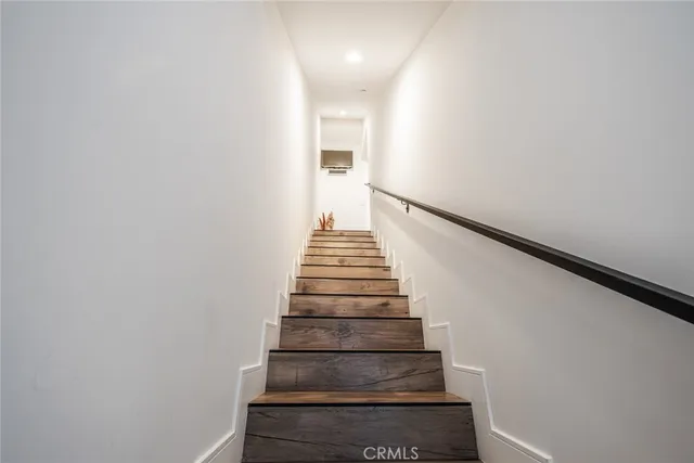 a view of backyard with seating space and trees